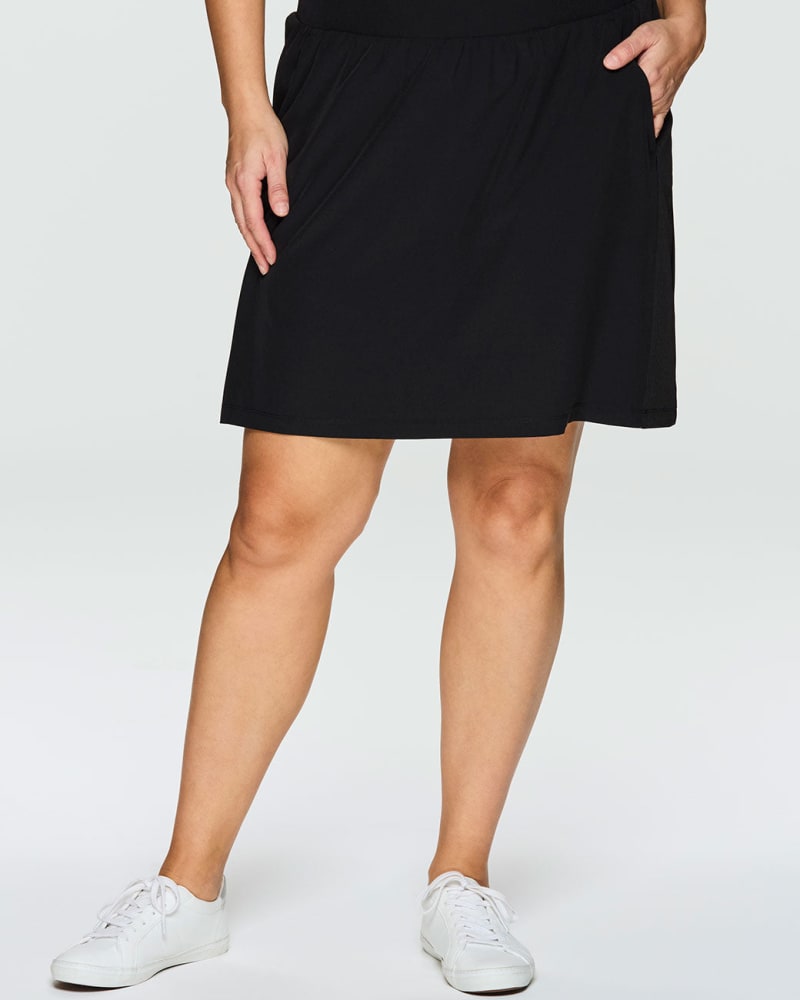 Front of a model wearing a size 1X Prime Ribbed Skort in Black by RBX Active. | dia_product_style_image_id:244893